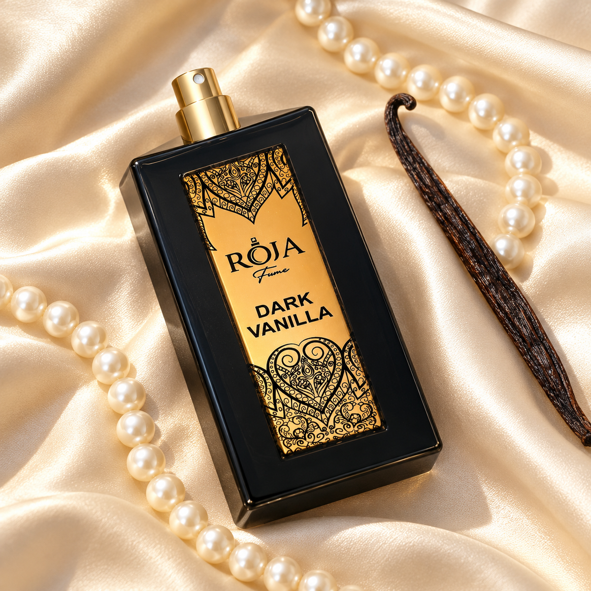Roja Fume Dark Vanilla Extrait de Parfum on ivory satin with pearls and a vanilla pod