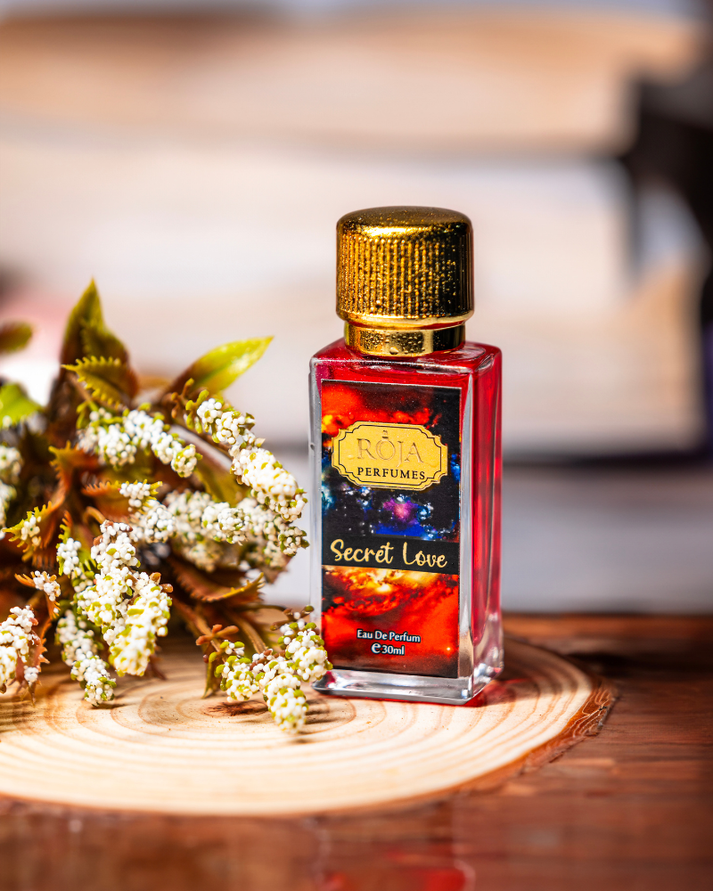 Roja Fume Secret Love perfume bottle with dried flowers