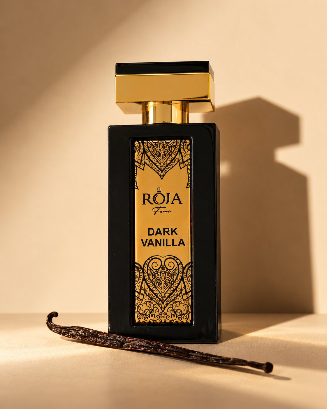 Roja Fume Dark Vanilla Extrait de Parfum with a vanilla bean