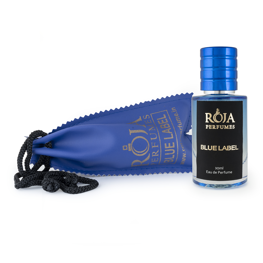Roja Fume Blue Label perfume bottle lying on its velvet pouch