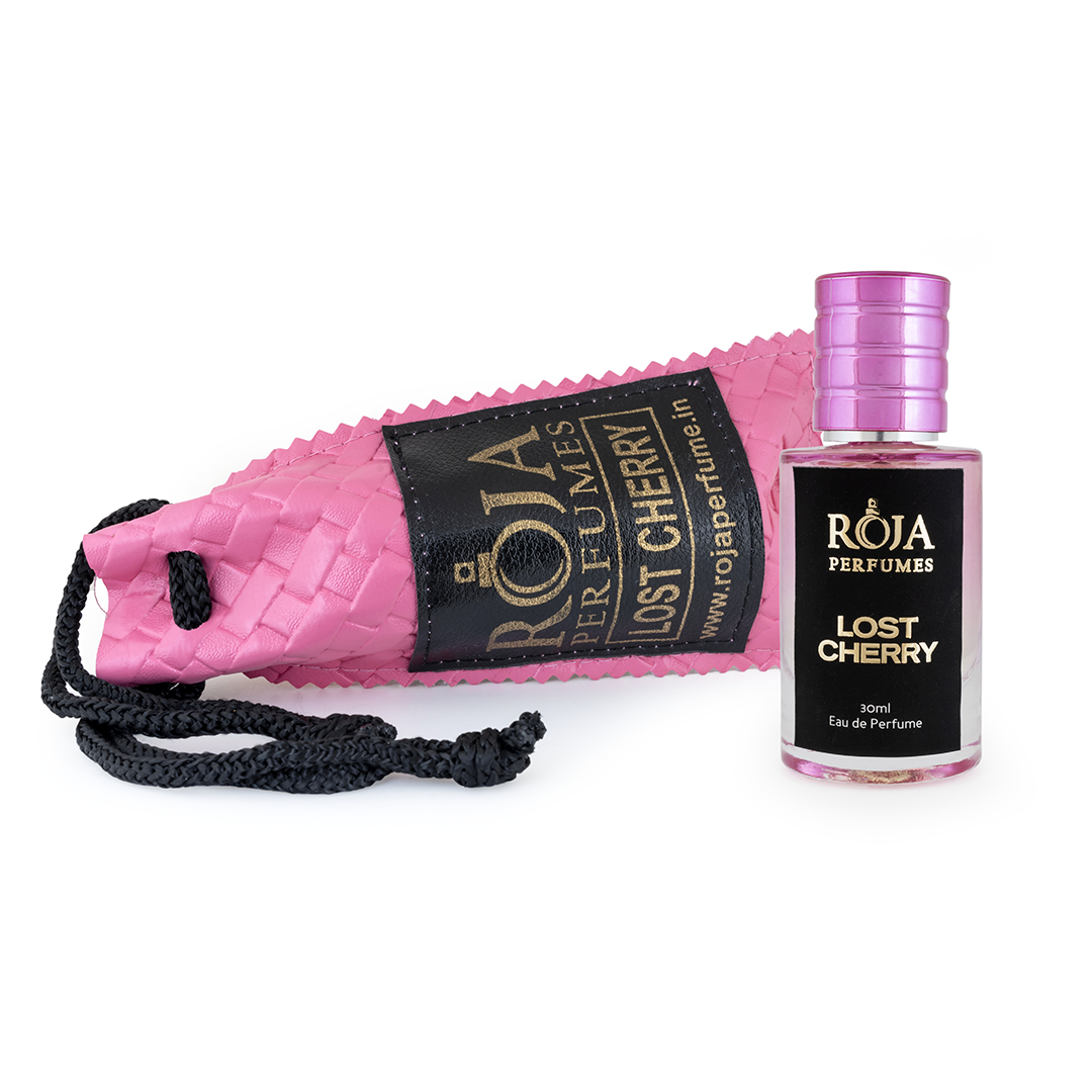 Roja Fume Lost Cherry perfume bottle lying on its velvet pouch